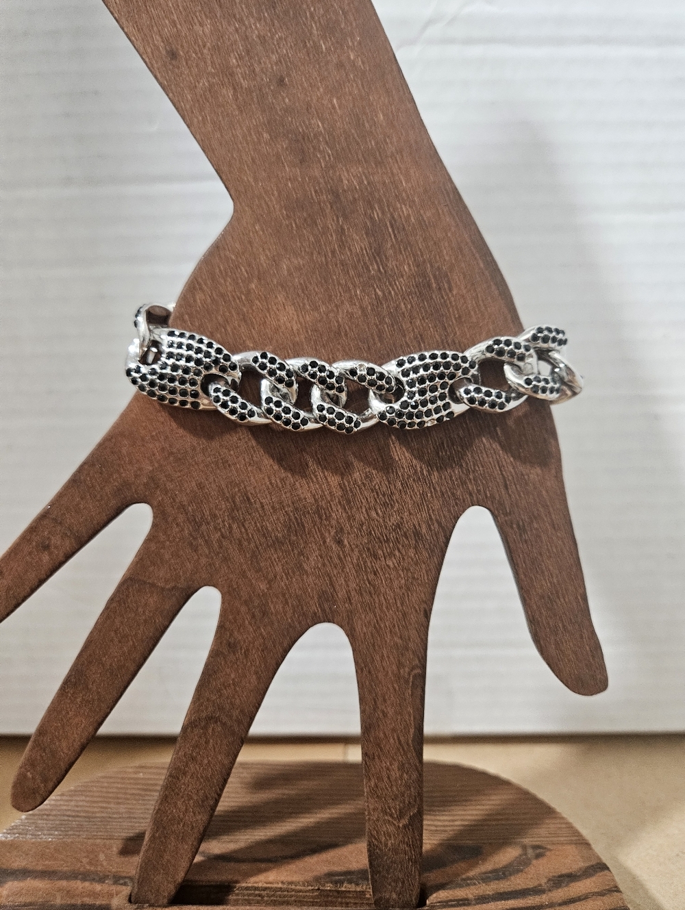 Black australian crystal link bracelet in silvertone. 7.25 Inches